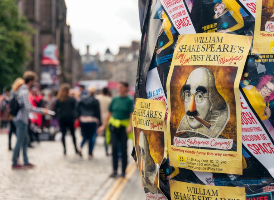 A picture of flyers stuck on a pole at the Edinburgh Fringe festival.