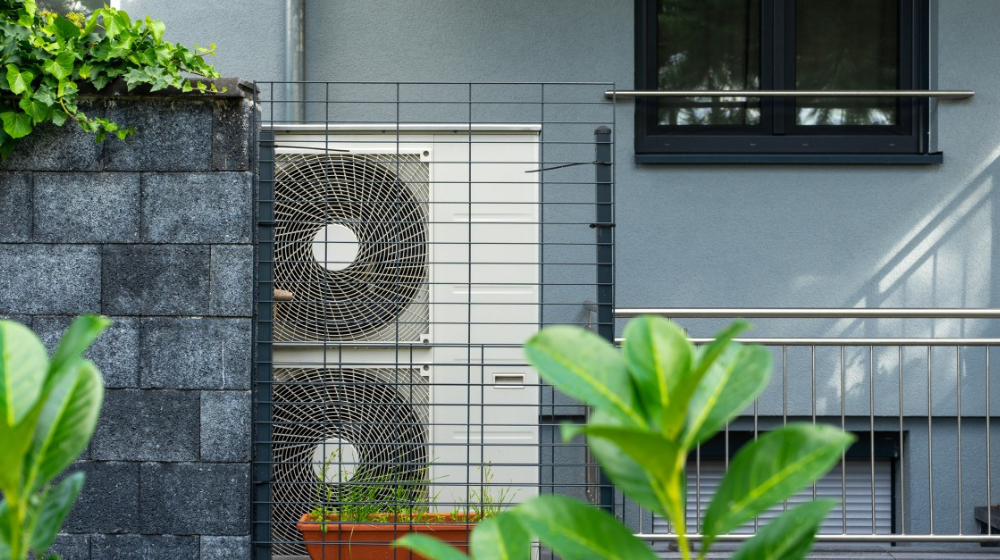 An air source heat pump outside a building