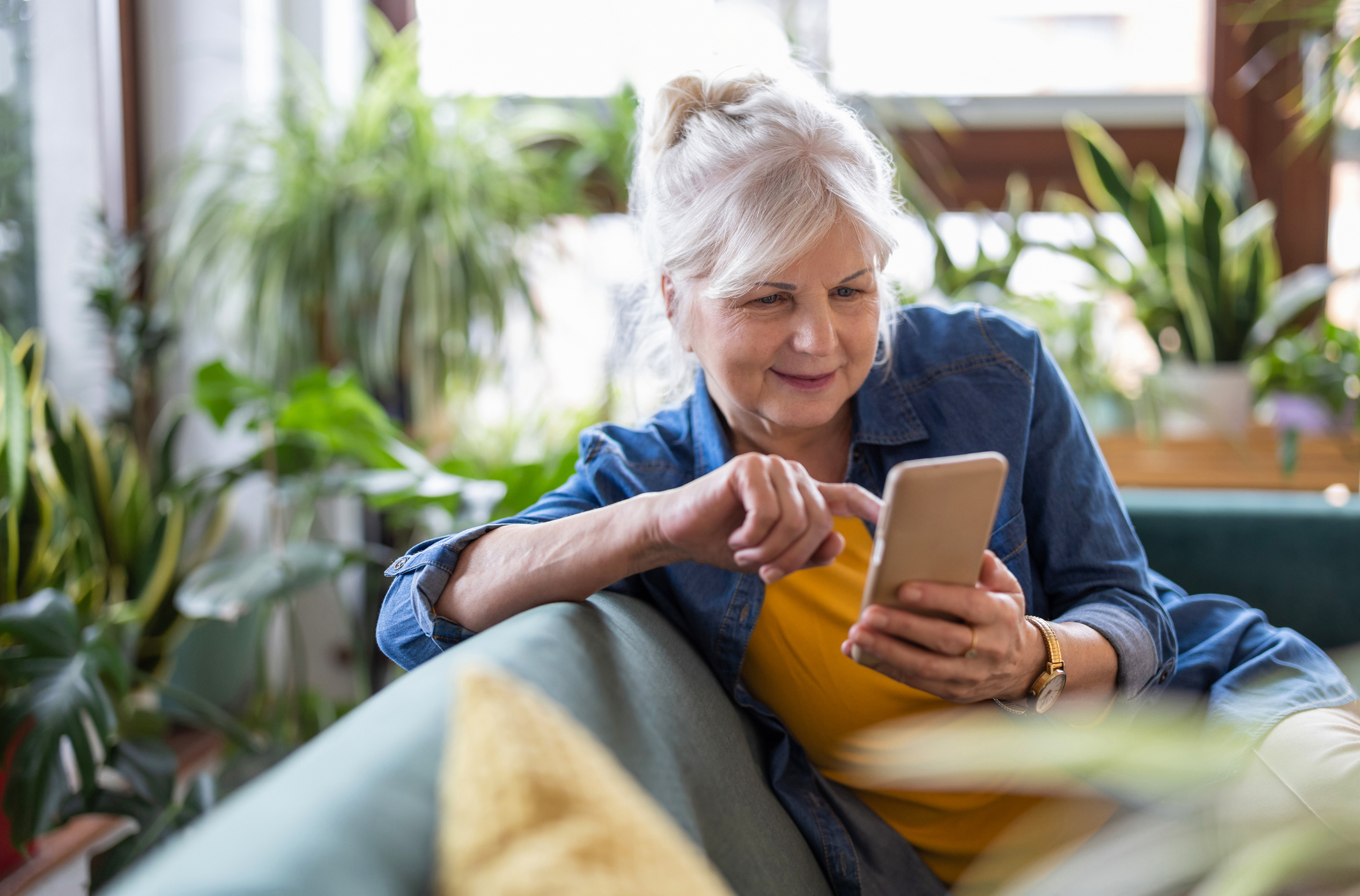 A person smiling at their phone