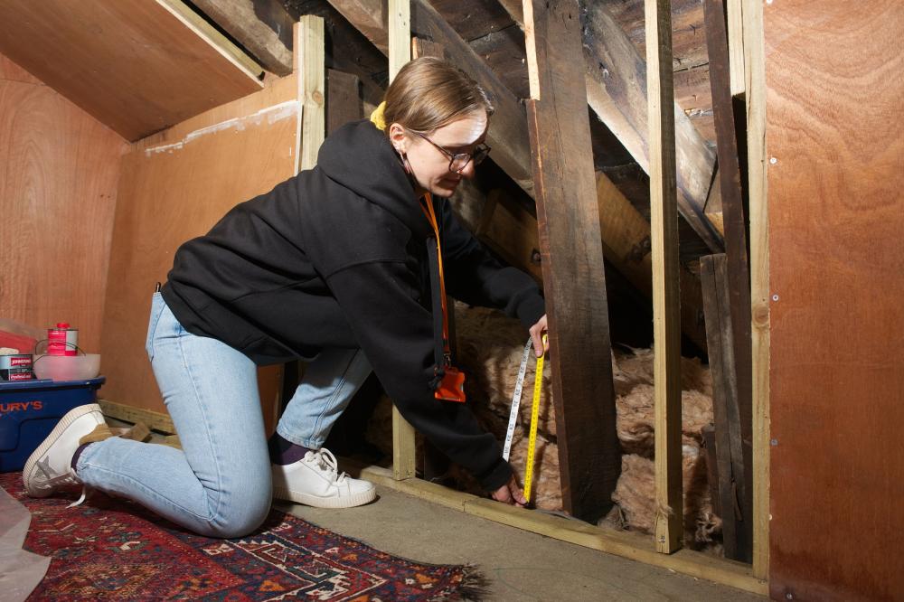 Insulation being installed in a home