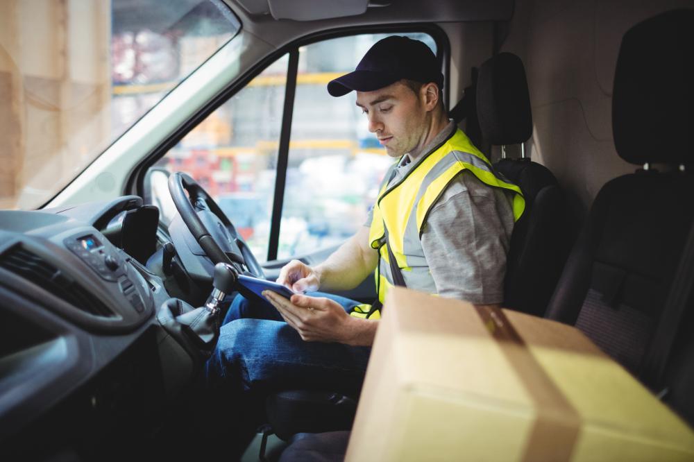 a delivery driver sitting in a van