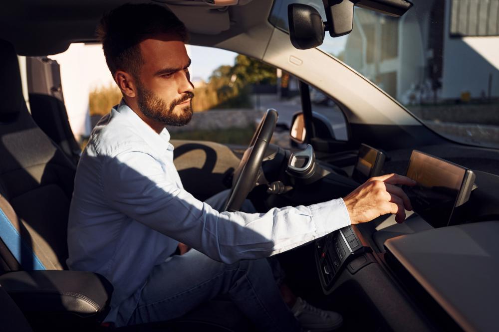 man driving an electric car