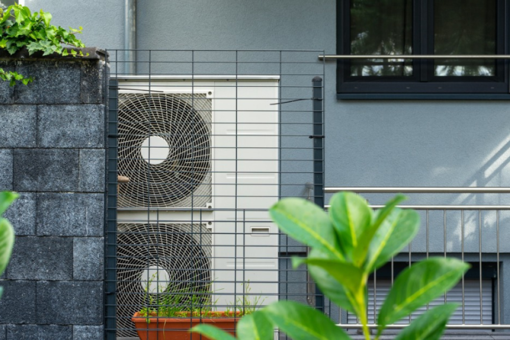 An air source heat pump outside a building