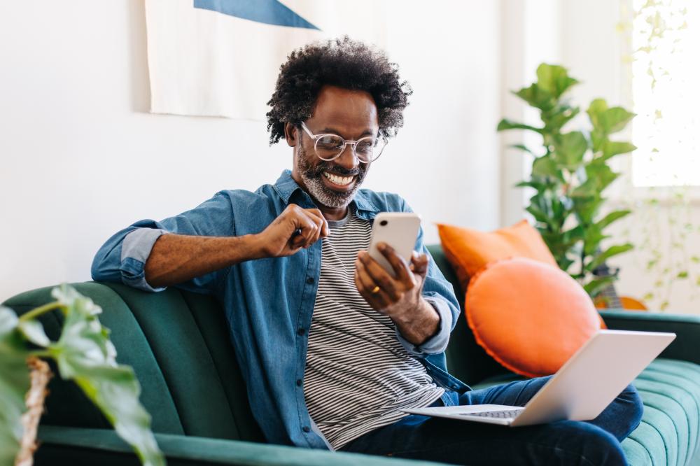 Man using his phone to contact HES